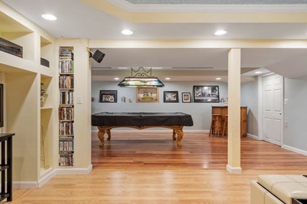 77 Teele Road Bolton, MA 01740 - Photo 27 of 41 a living room with furniture a table and kitchen view