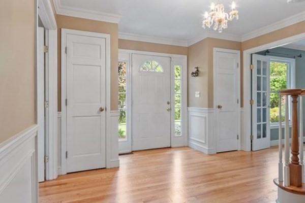 77 Teele Road Bolton, MA 01740 - Photo 3 of 41 wooden floor with windows and chandelier in an empty room