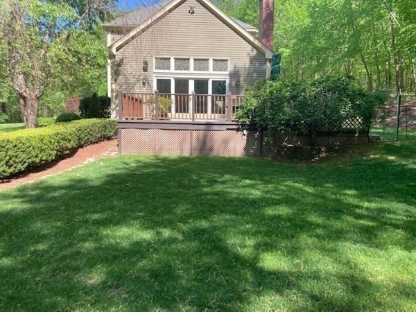 77 Teele Road Bolton, MA 01740 - Photo 31 of 41 a front view of a house with a yard