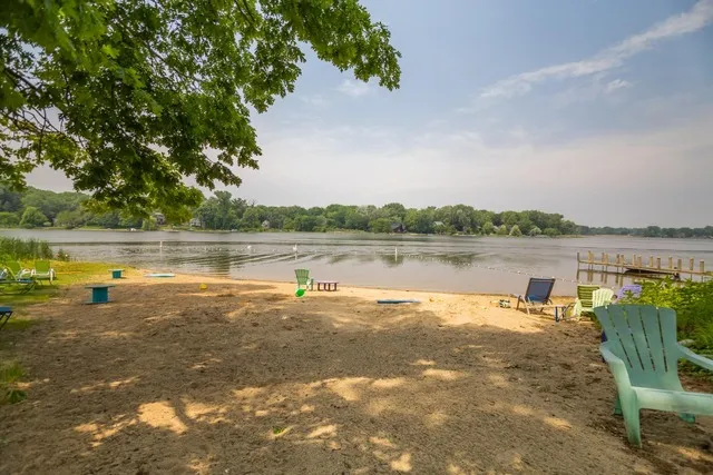 a view of a lake with houses in the background