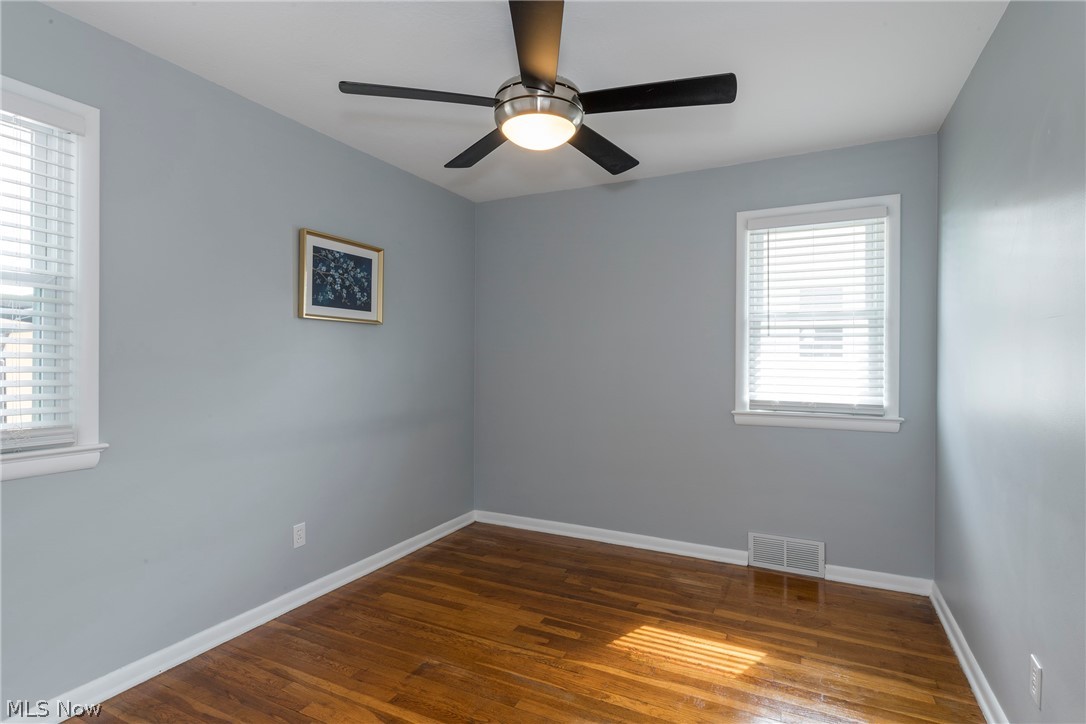 13175 McCracken Road Cleveland, OH 44125 - Photo 20 of 48 Bedroom featuring dark hardwood / wood-style flooring and ceiling fan