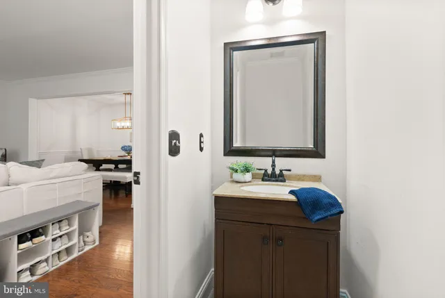 a view of entryway and hall with wooden floor
