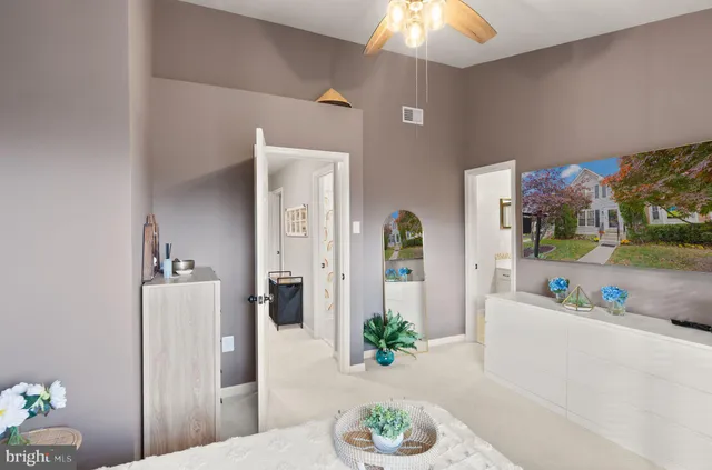 a bathroom with a double vanity sink mirror and bathtub