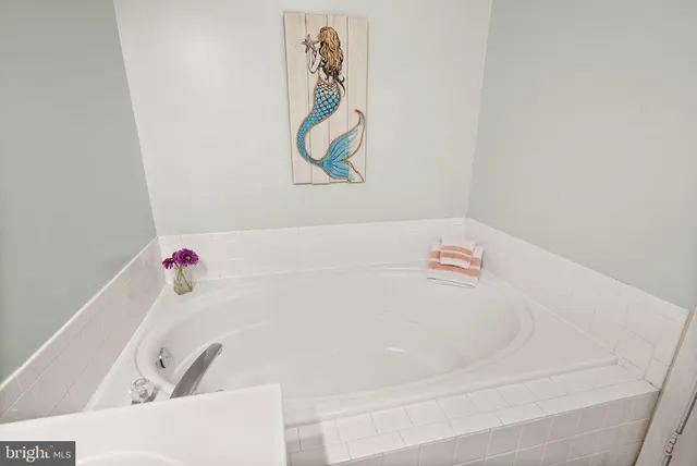 a room that has a bed and a table in it