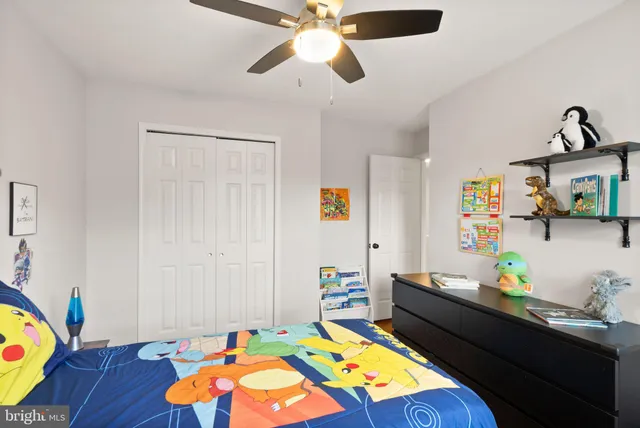 a bathroom with a toilet a sink and a mirror