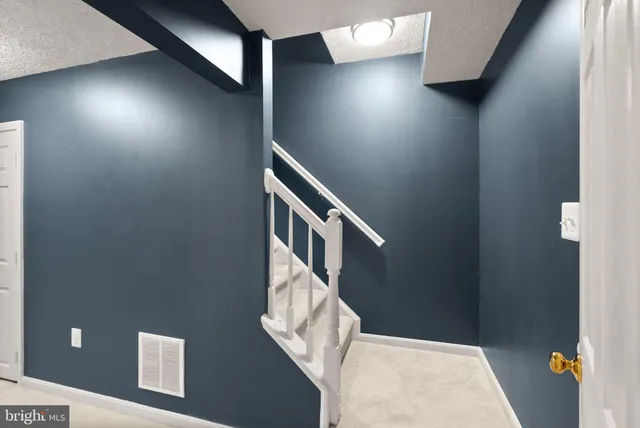 a view of a balcony with wooden floor and fence