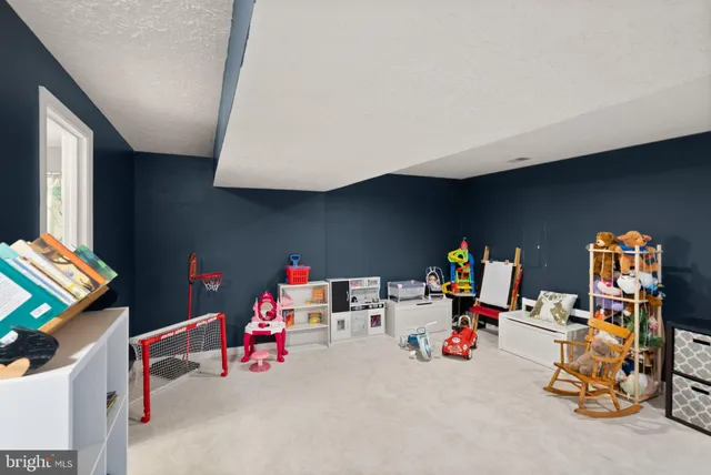 a view of a house with a yard and pathway