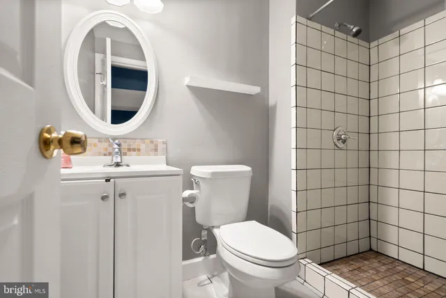 a picture of a bench in front of a wall