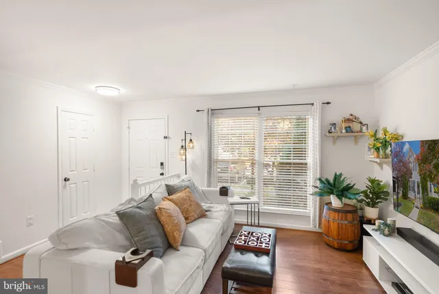 a view of a dining room with furniture wooden floor and chandelier
