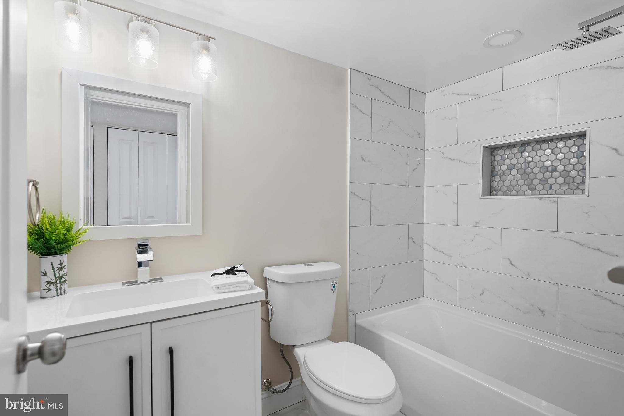 715 Longfellow Street Northwest Washington, DC 20011 - Photo 14 of 21 a bathroom with a sink a toilet and shower