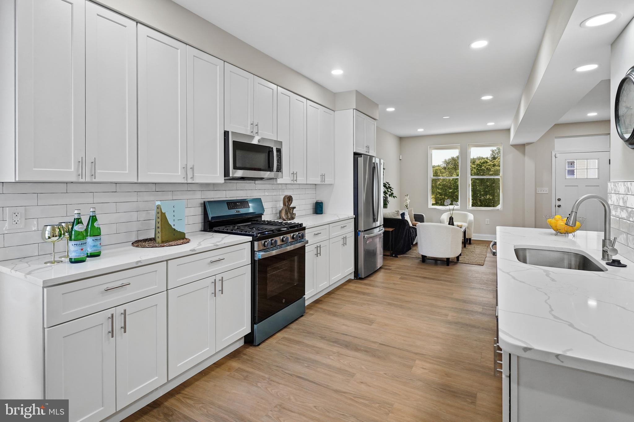 715 Longfellow Street Northwest Washington, DC 20011 - Photo 18 of 21 a kitchen with a sink cabinets and stainless steel appliances
