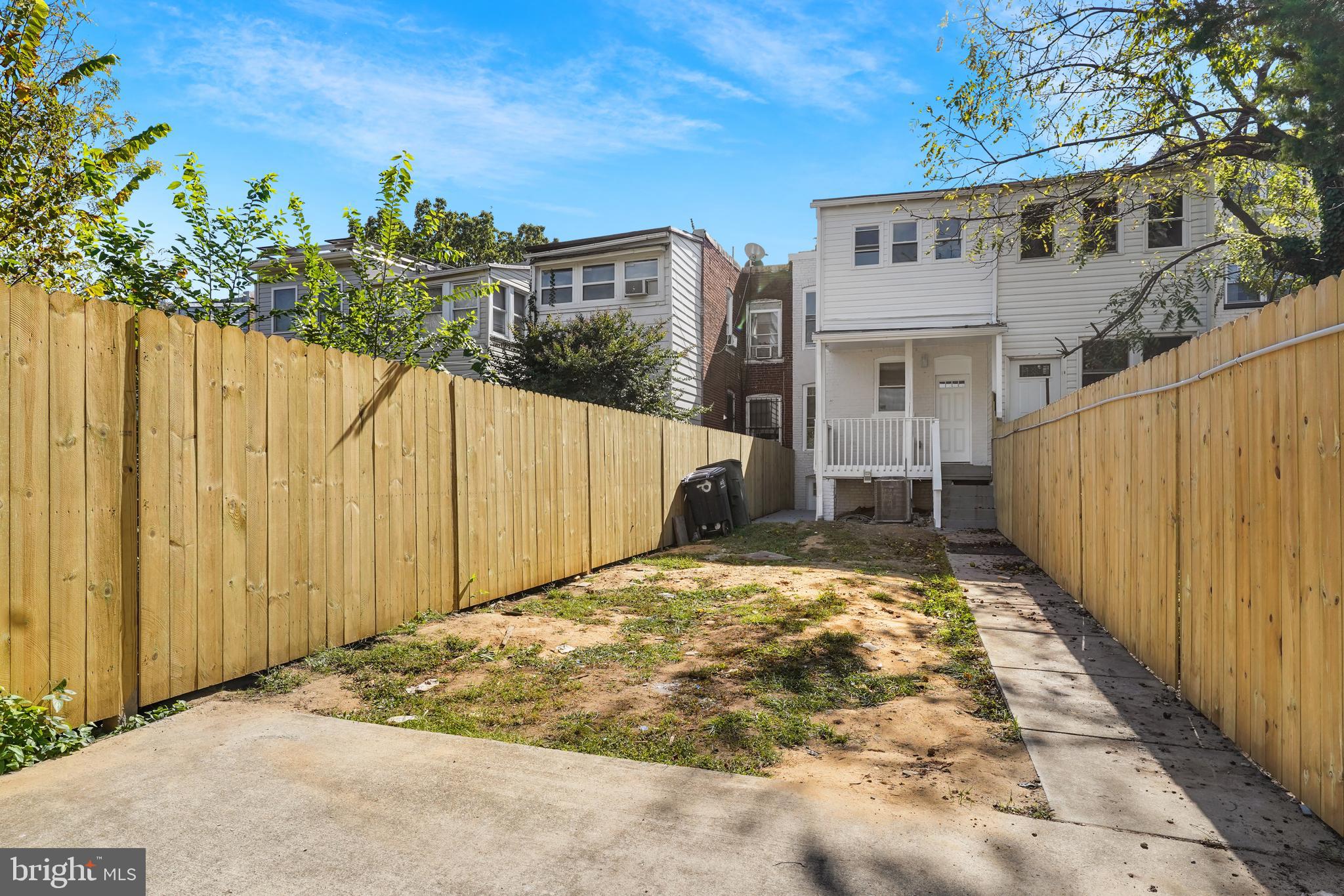 715 Longfellow Street Northwest Washington, DC 20011 - Photo 20 of 21 a view of a house with a small yard and plants