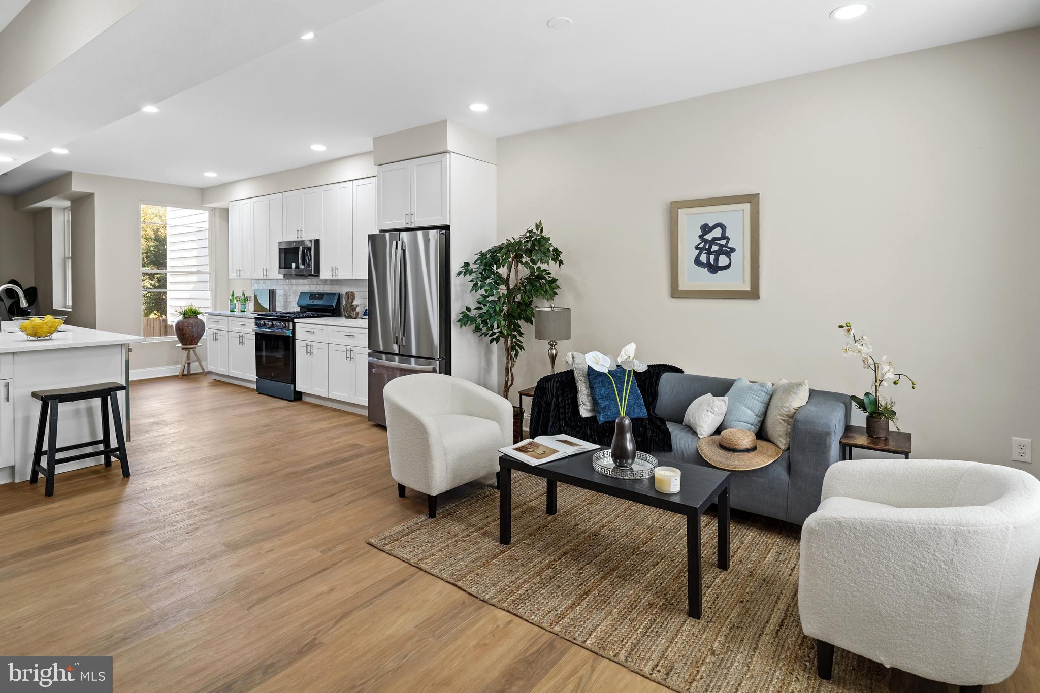 715 Longfellow Street Northwest Washington, DC 20011 - Photo 2 of 21 a living room with furniture wooden floor and kitchen view