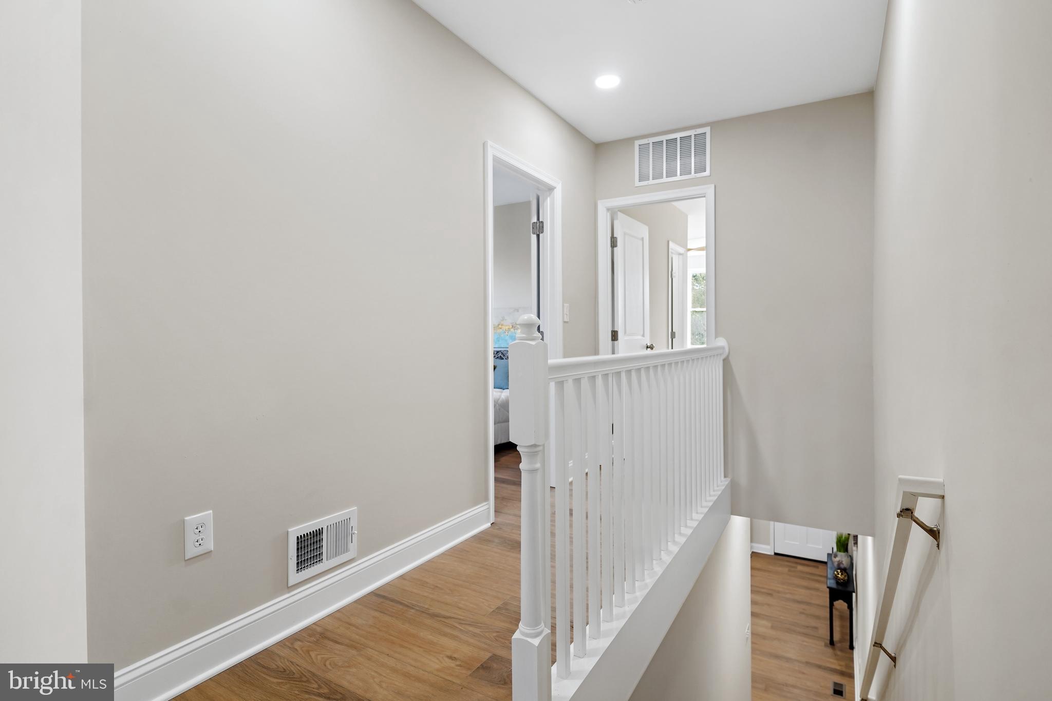 715 Longfellow Street Northwest Washington, DC 20011 - Photo 7 of 21 a view of a hallway with wooden floor and staircase