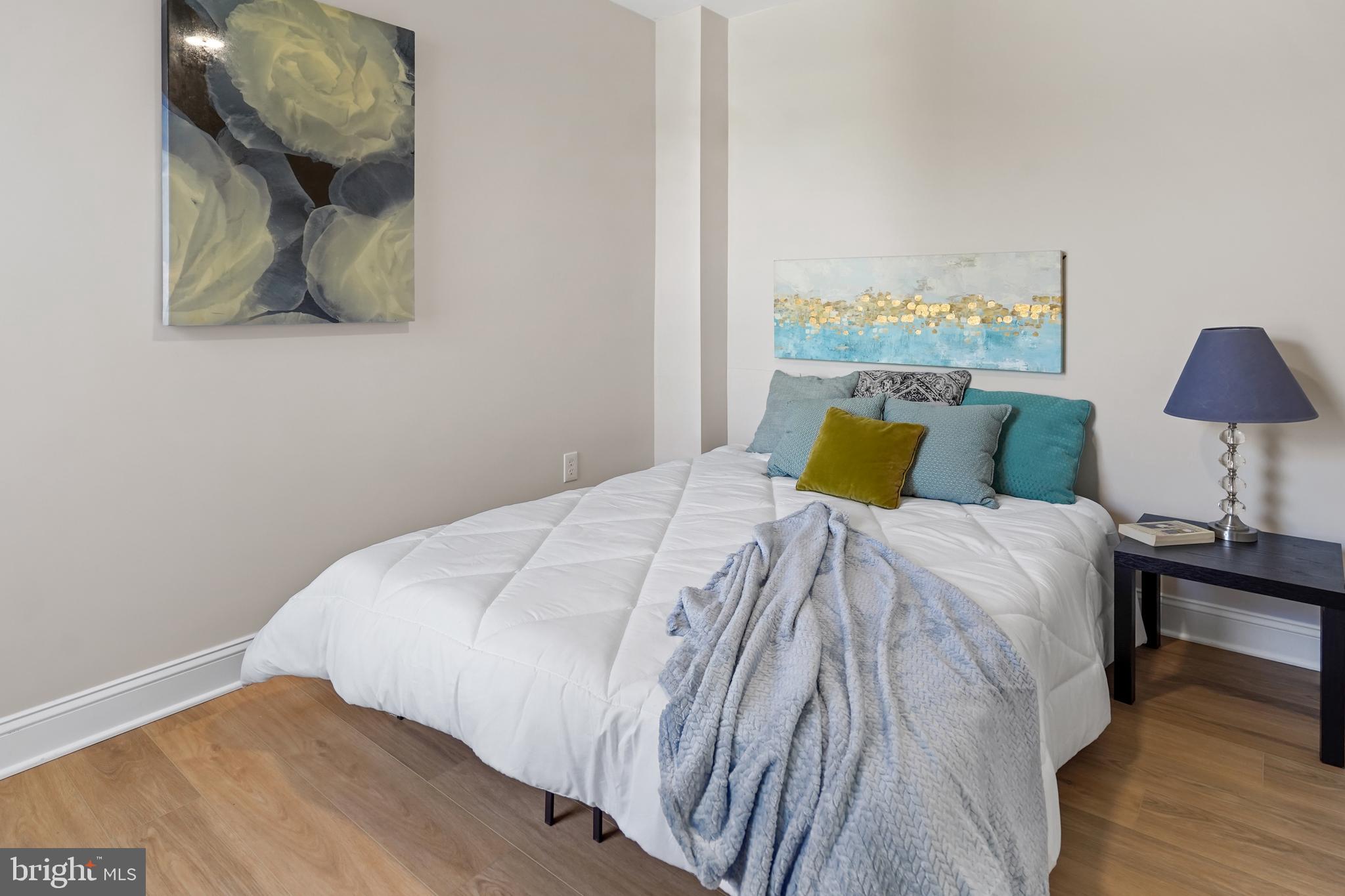 715 Longfellow Street Northwest Washington, DC 20011 - Photo 10 of 21 a bedroom with a bed and lamp