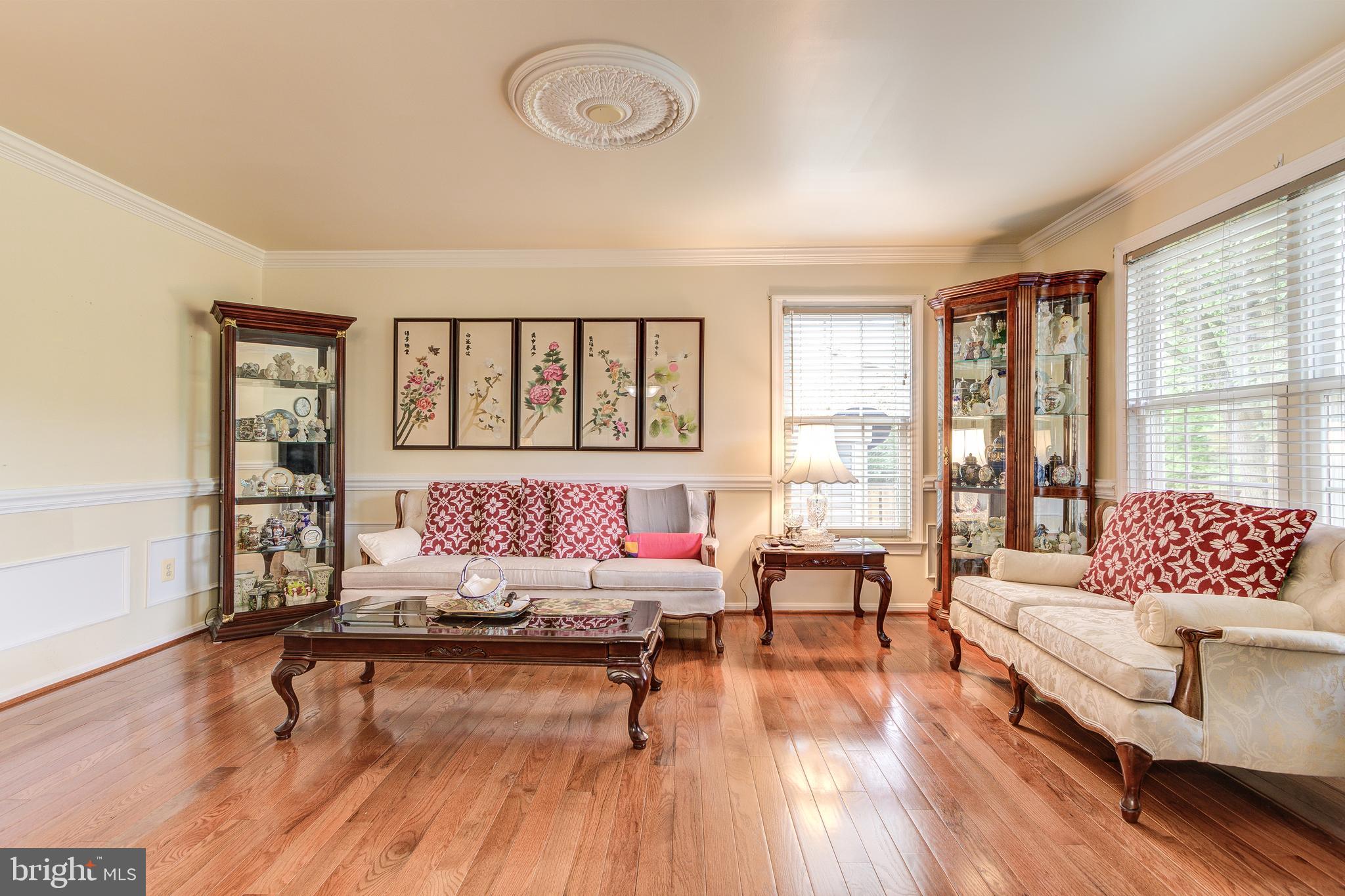21787 Canfield Terrace Sterling, VA 20164 - Photo 17 of 46 Bright and spacious living room with wood floors