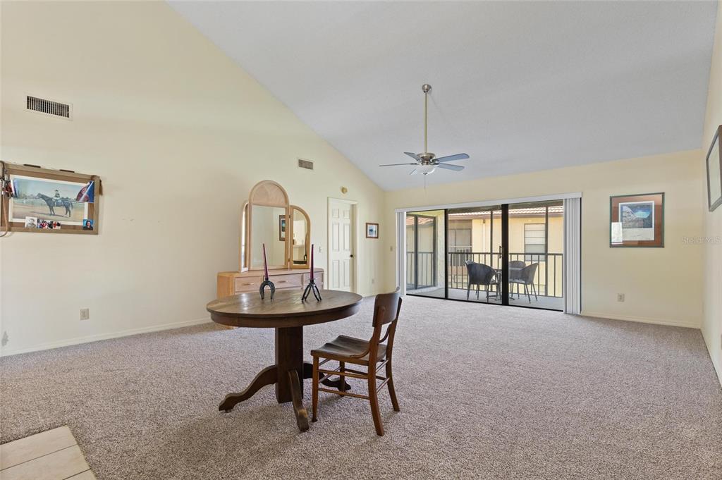 1801 East Lake Road South, Unit 4E Palm Harbor, FL 34685 - Photo 11 of 26 a view of a room with furniture and windows