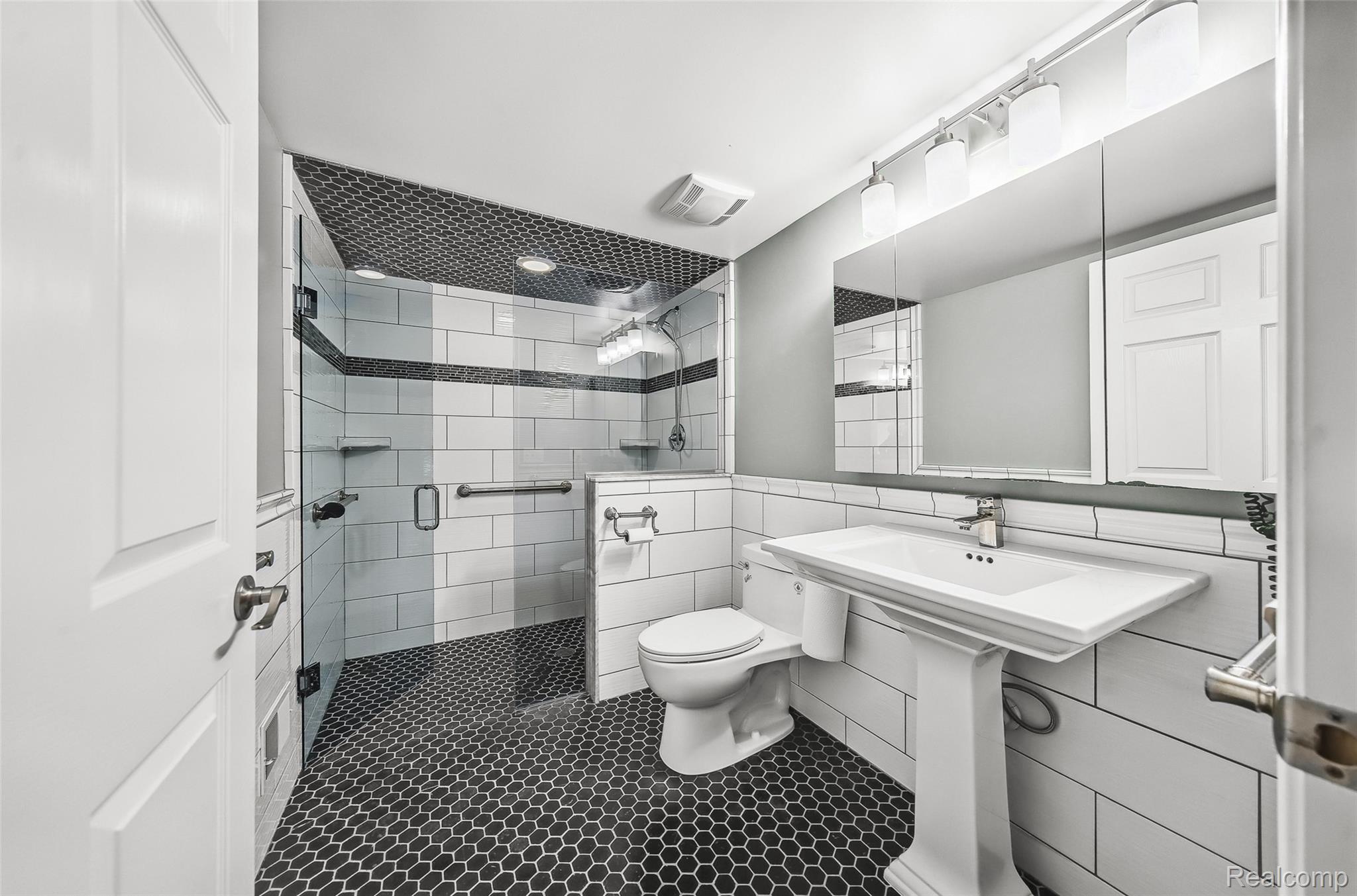 100 Overhill Road Bloomfield Hills, MI 48301 - Photo 17 of 55 Full bath featuring tile walls, tile patterned flooring, and a stall shower