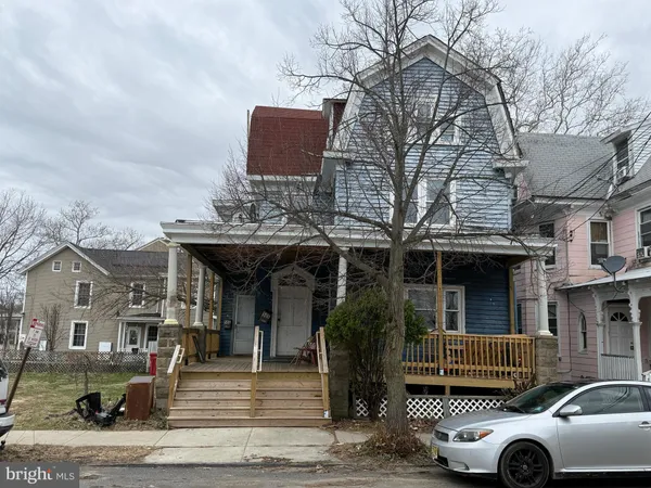 a front view of a building with parking space