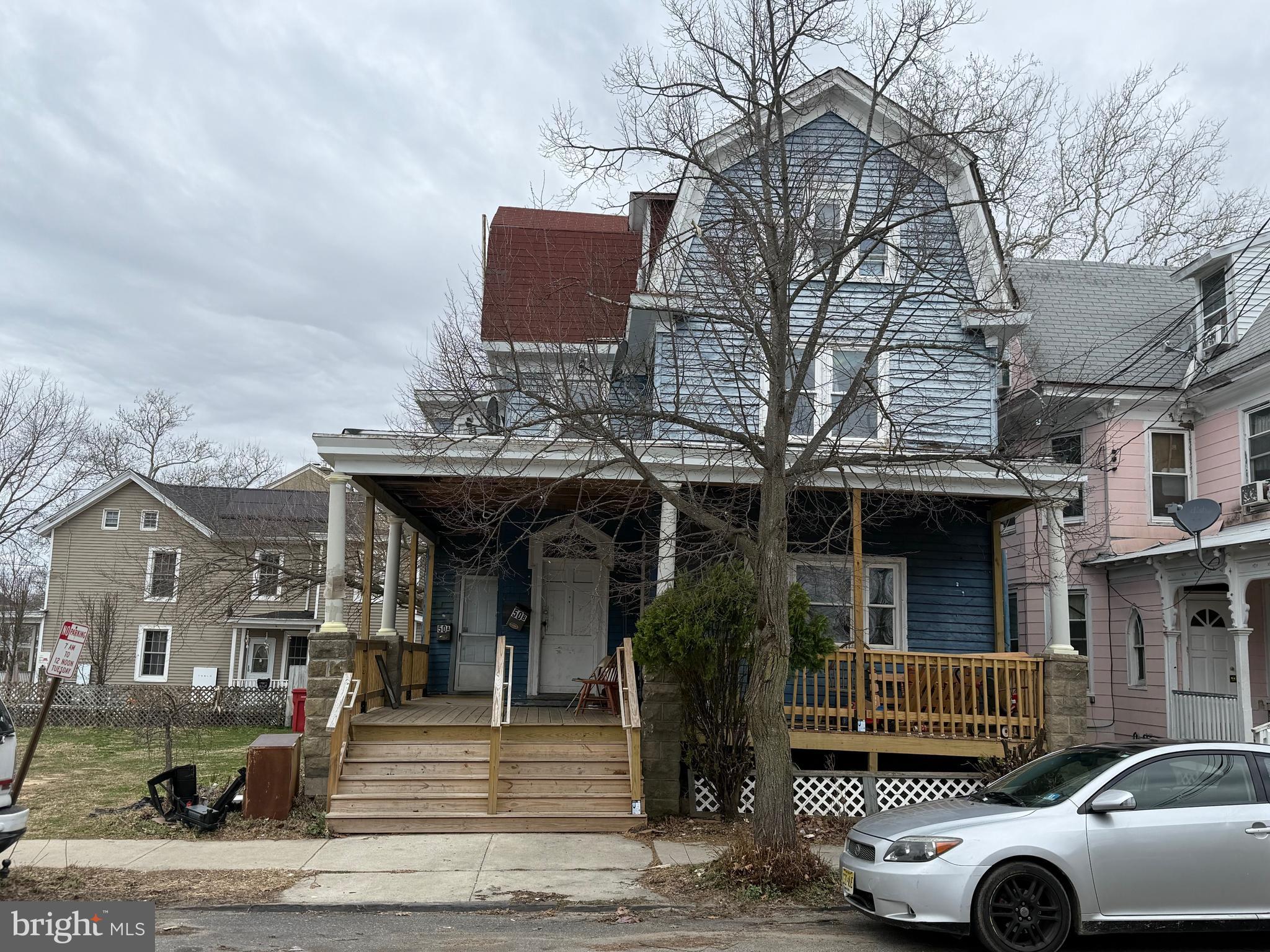 a front view of a building with parking space