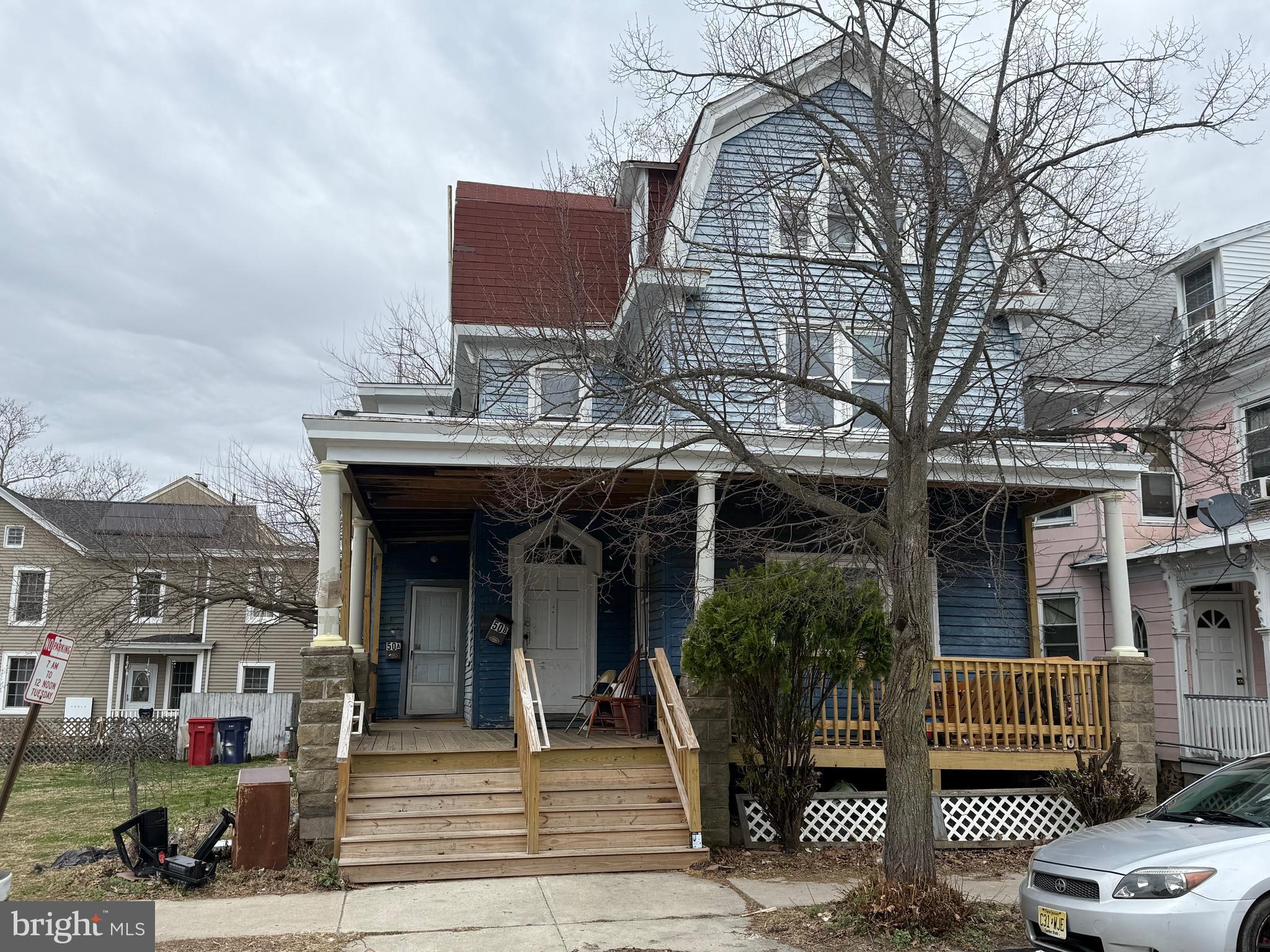 50 Bank Street Bridgeton, NJ 08302 - Photo 2 of 2 a view of a house with brick walls and floor to ceiling windows