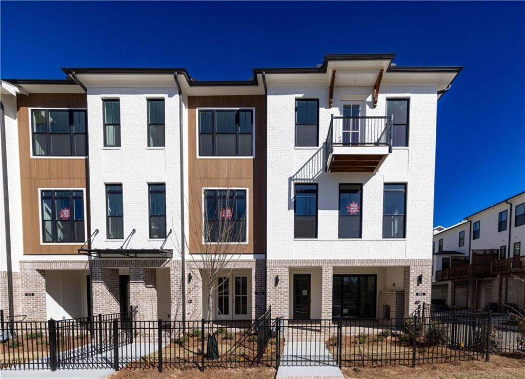 362 Olmstead Way, Unit 23 Alpharetta, GA 30022 - Photo 1 of 43 a view of a building with a lot of windows