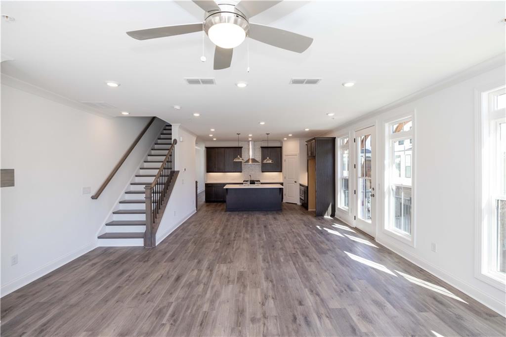 362 Olmstead Way, Unit 23 Alpharetta, GA 30022 - Photo 14 of 43 a view of a livingroom with furniture staircase and a ceiling fan