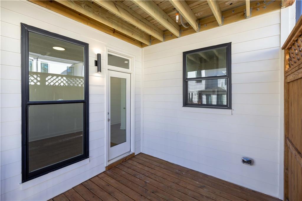 362 Olmstead Way, Unit 23 Alpharetta, GA 30022 - Photo 17 of 43 a view of hallway with wooden floor and a window