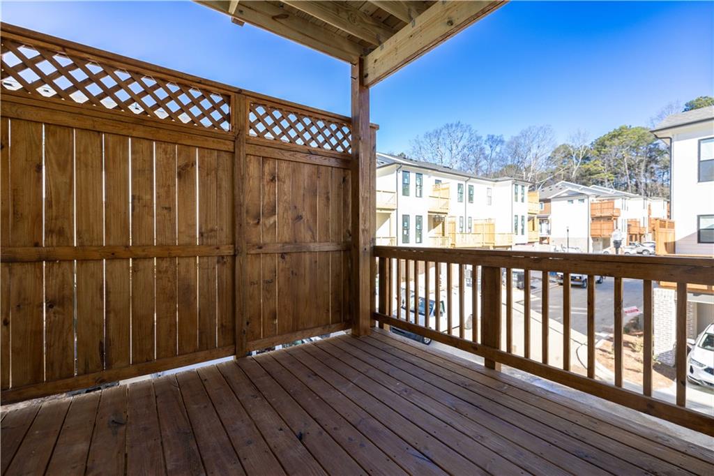362 Olmstead Way, Unit 23 Alpharetta, GA 30022 - Photo 18 of 43 a view of a balcony with wooden floor