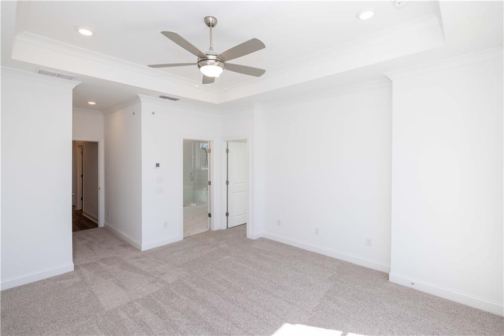 362 Olmstead Way, Unit 23 Alpharetta, GA 30022 - Photo 21 of 43 an empty room with a ceiling fan and a window