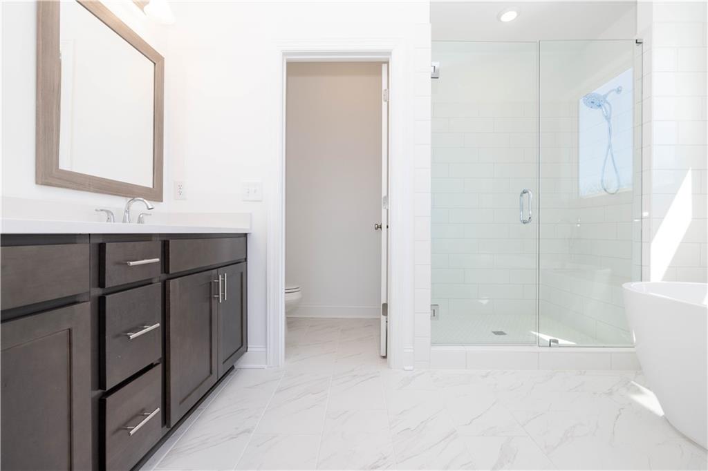362 Olmstead Way, Unit 23 Alpharetta, GA 30022 - Photo 22 of 43 a bathroom with a sink and a mirror