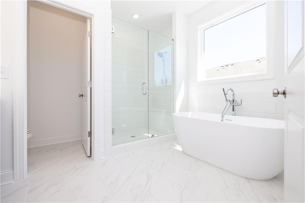 362 Olmstead Way, Unit 23 Alpharetta, GA 30022 - Photo 23 of 43 a bathroom with a bathtub and a shower