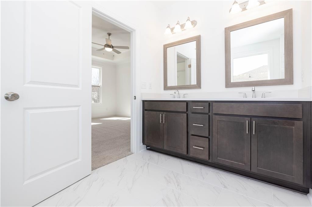 362 Olmstead Way, Unit 23 Alpharetta, GA 30022 - Photo 24 of 43 a spacious bathroom with a double vanity sink a mirror and a