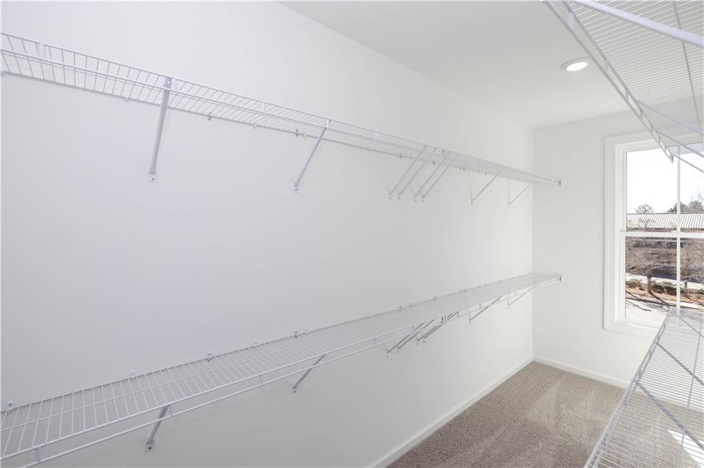 362 Olmstead Way, Unit 23 Alpharetta, GA 30022 - Photo 26 of 43 a view of a room with racks on the wall