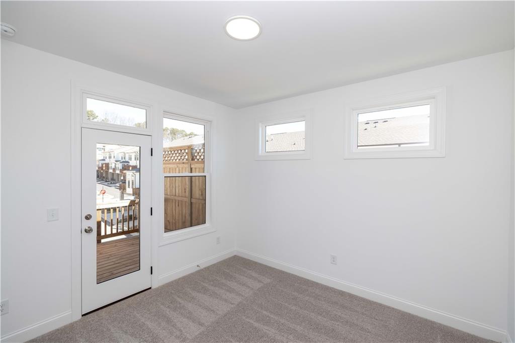362 Olmstead Way, Unit 23 Alpharetta, GA 30022 - Photo 29 of 43 an empty room with windows