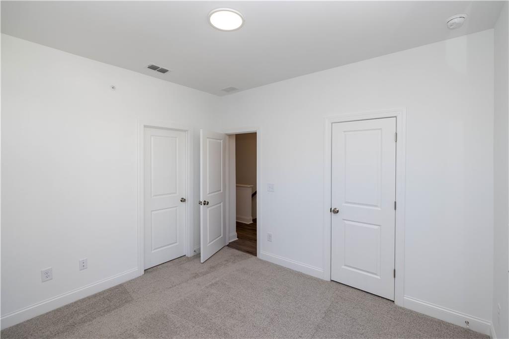 362 Olmstead Way, Unit 23 Alpharetta, GA 30022 - Photo 30 of 43 an empty room with closet area