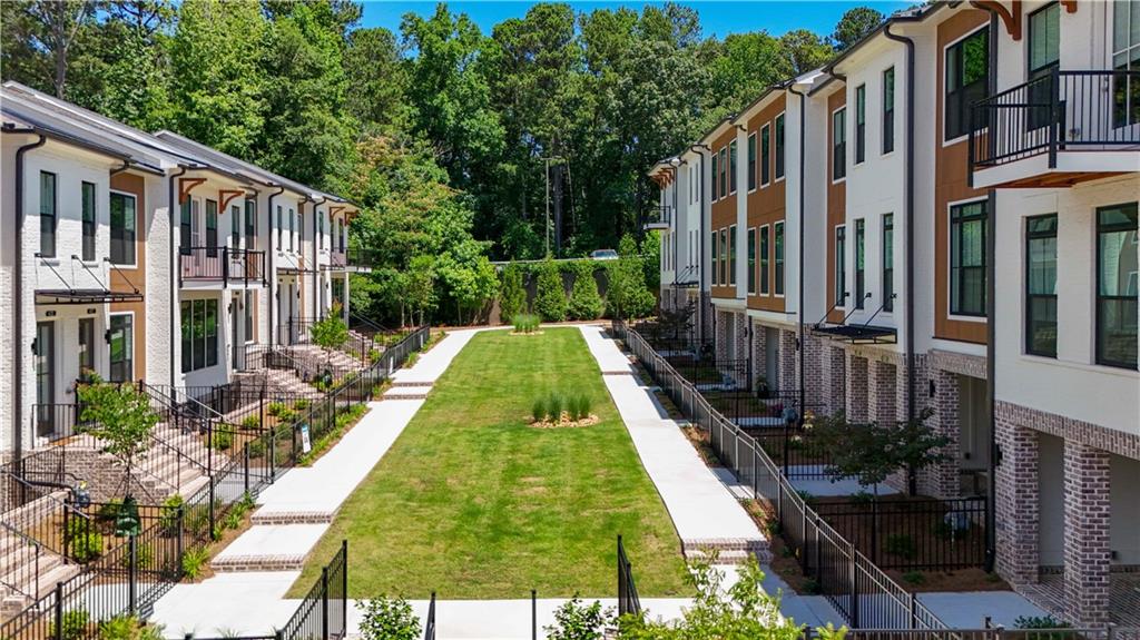 362 Olmstead Way, Unit 23 Alpharetta, GA 30022 - Photo 36 of 43 a view of swimming pool with a garden