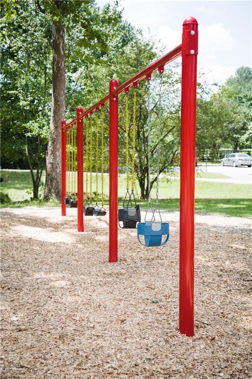 362 Olmstead Way, Unit 23 Alpharetta, GA 30022 - Photo 43 of 43 a view of a park with large trees and a small barn