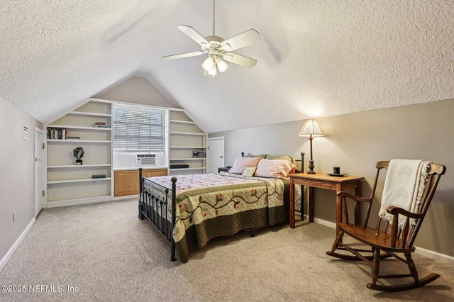 a building outdoor space with patio furniture and potted plants