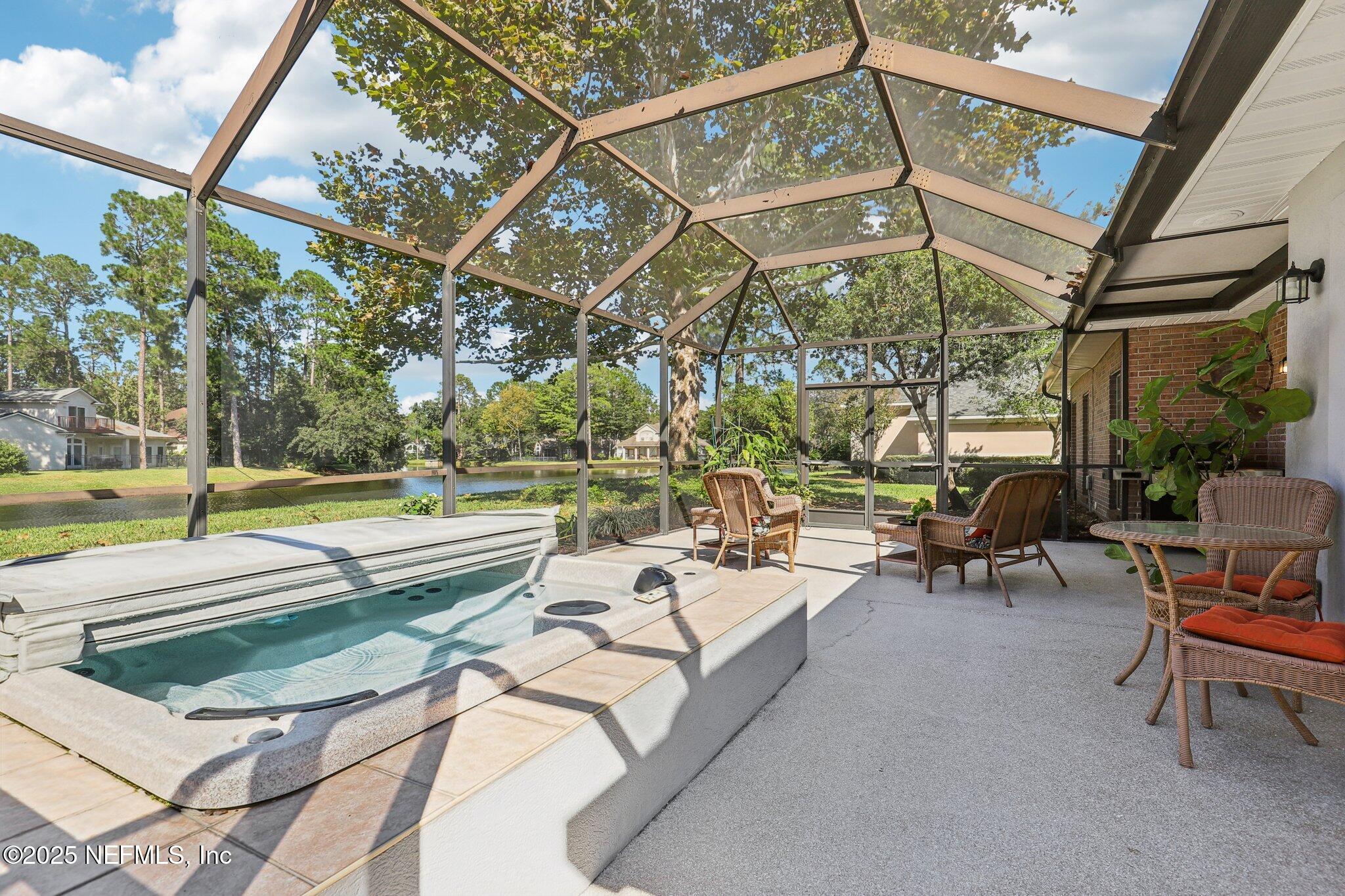 1432 Course View Drive Fleming Island, FL 32003 - Photo 16 of 83 a view of a swimming pool with a patio and a yard