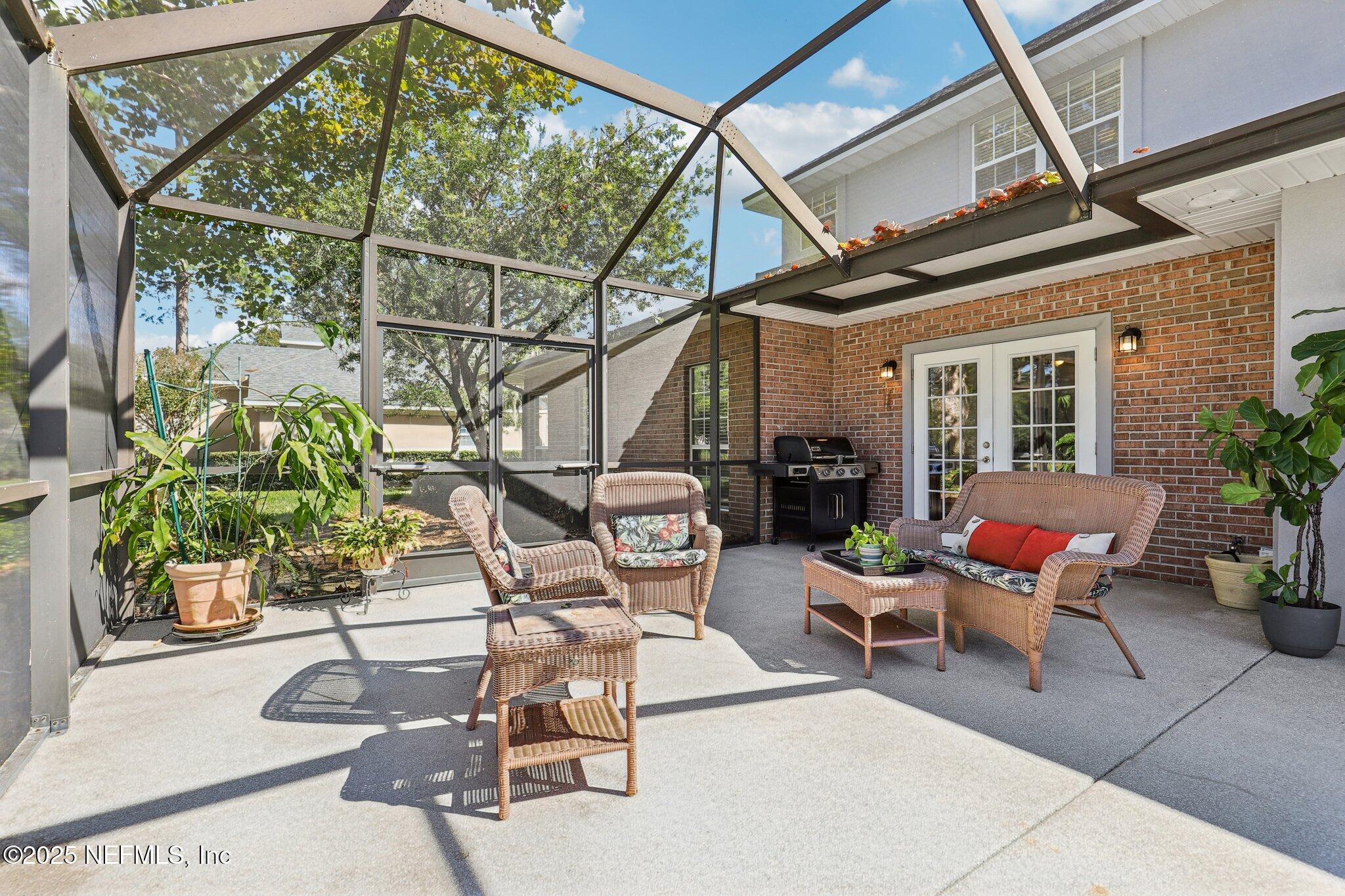 1432 Course View Drive Fleming Island, FL 32003 - Photo 17 of 83 a building outdoor space with patio furniture and potted plants