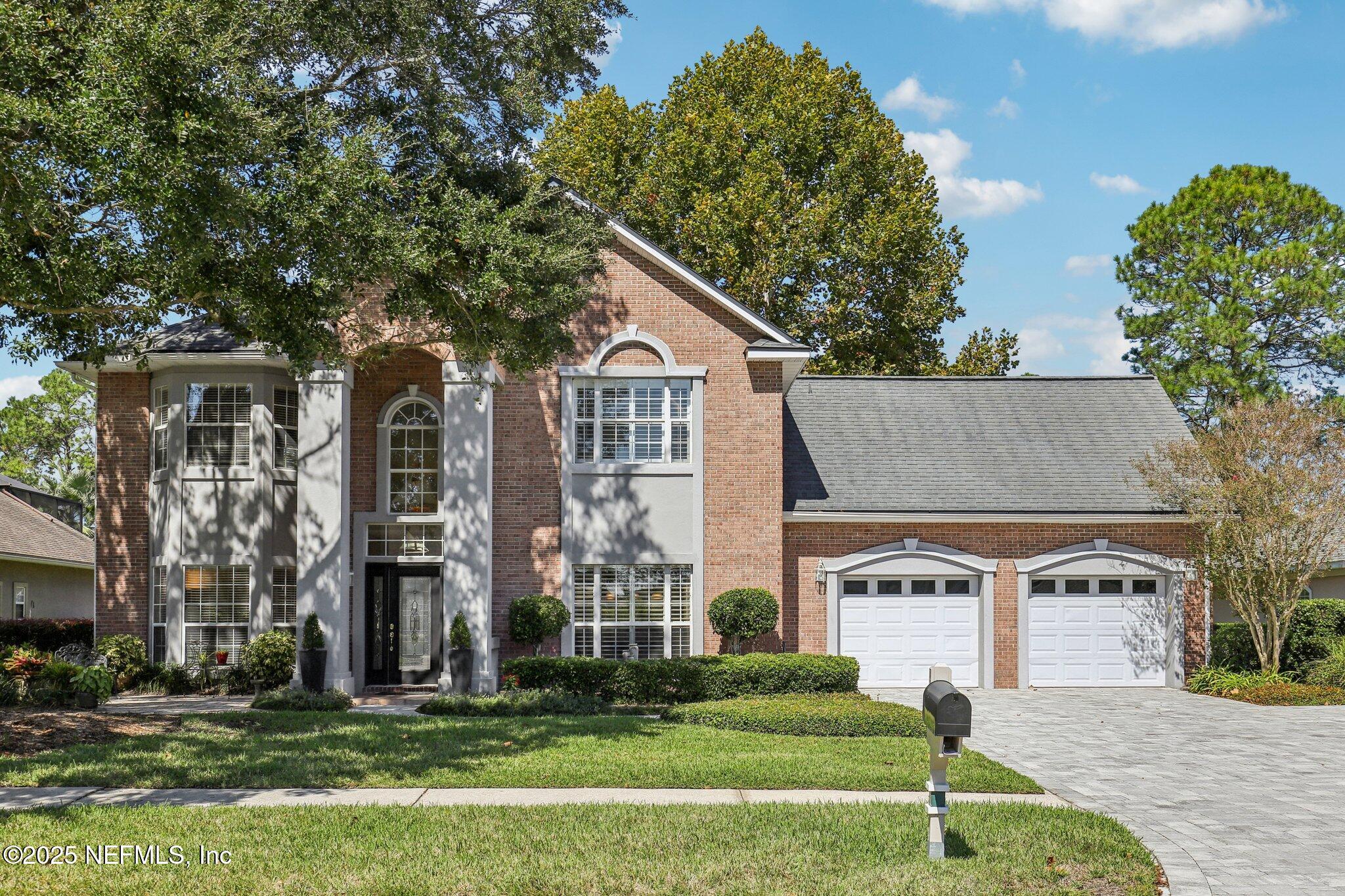 1432 Course View Drive Fleming Island, FL 32003 - Photo 18 of 83 a front view of a house with a garden