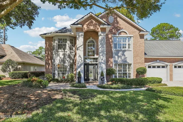a kitchen with granite countertop a sink and cabinets