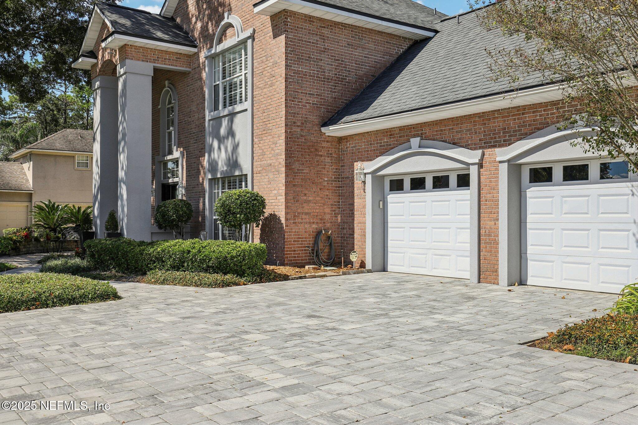 1432 Course View Drive Fleming Island, FL 32003 - Photo 22 of 83 a front view of a house with a yard and garage