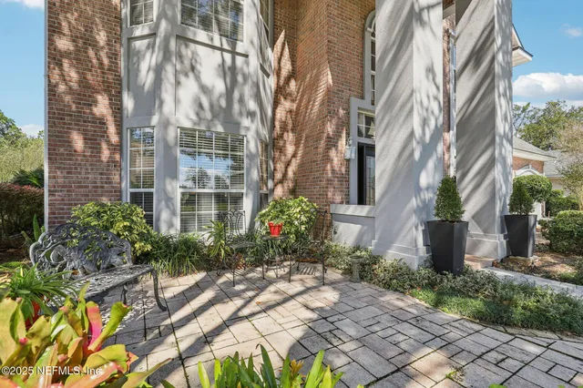a kitchen with stainless steel appliances granite countertop a refrigerator stove and sink