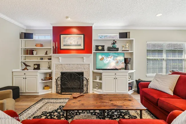 a view of a livingroom with furniture and a window