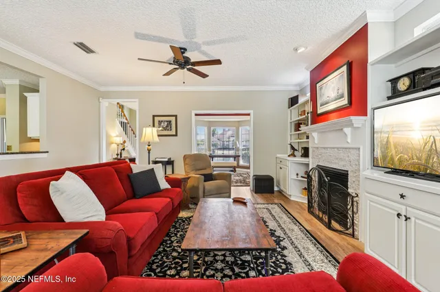 a bathroom with a granite countertop sink a mirror a bathtub and shower