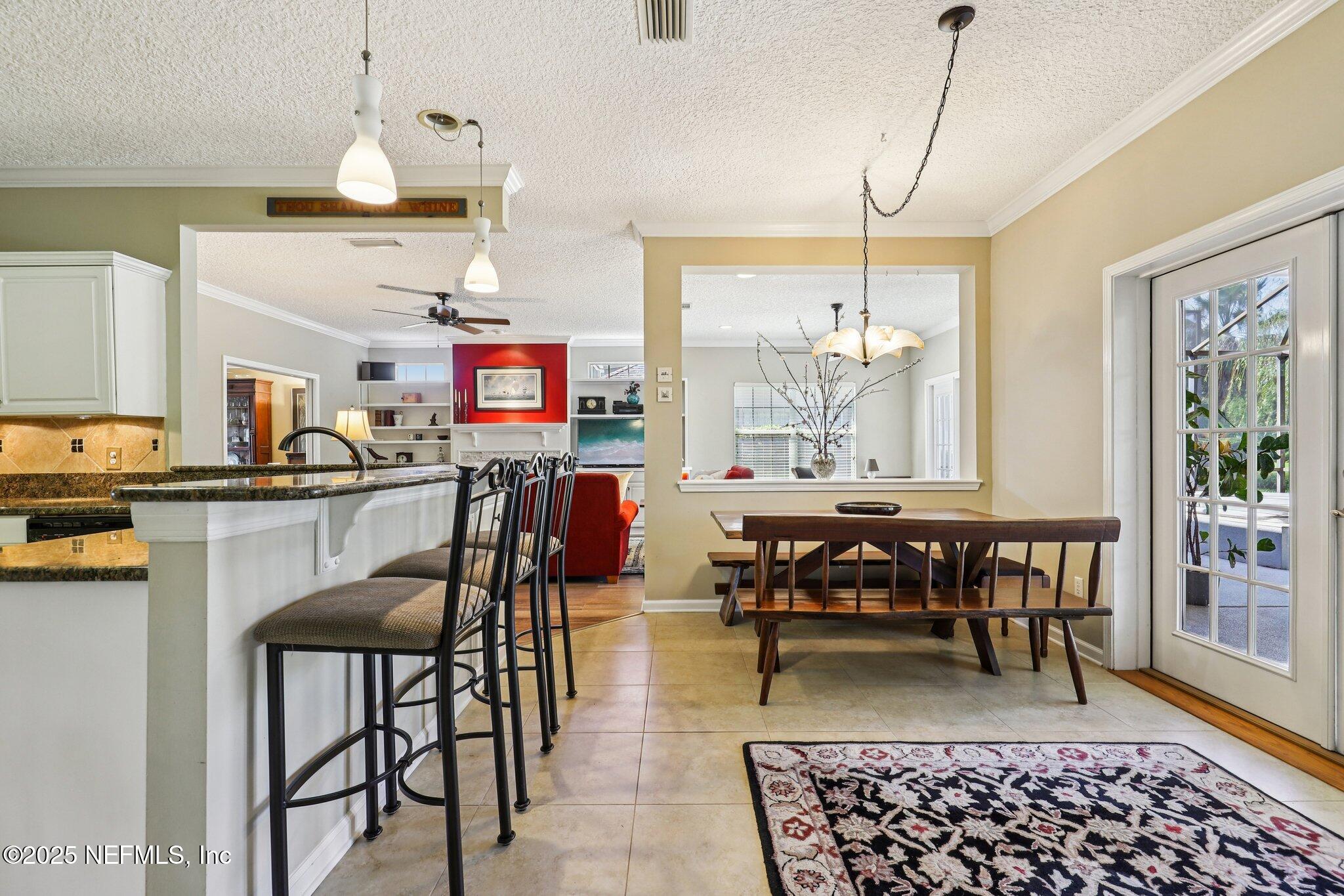 1432 Course View Drive Fleming Island, FL 32003 - Photo 27 of 83 a view of a a dining room with furniture window and wooden floor
