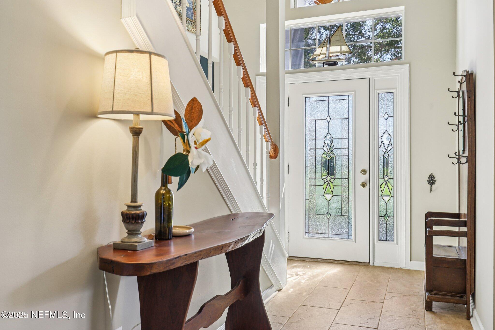 1432 Course View Drive Fleming Island, FL 32003 - Photo 3 of 83 a view of entryway and hall with a mirror