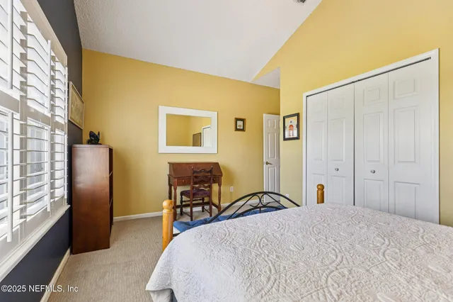 a living room with furniture rug and window